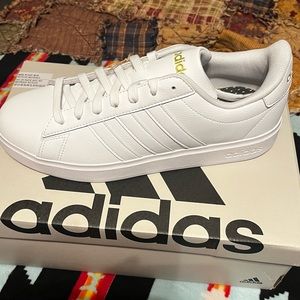 Adidas brand new shoes. White size 10. Tried on never worn.